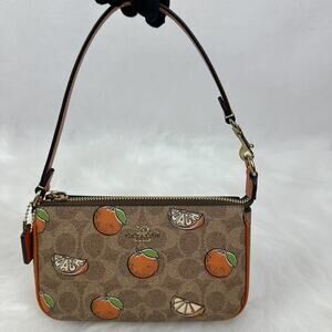 Coach Nolita 19 In Signature Canvas With Orange Print mini bag wristlet CAL27